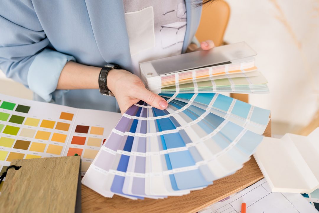 Close up of architect woman choosing samples of wall paint .jpg